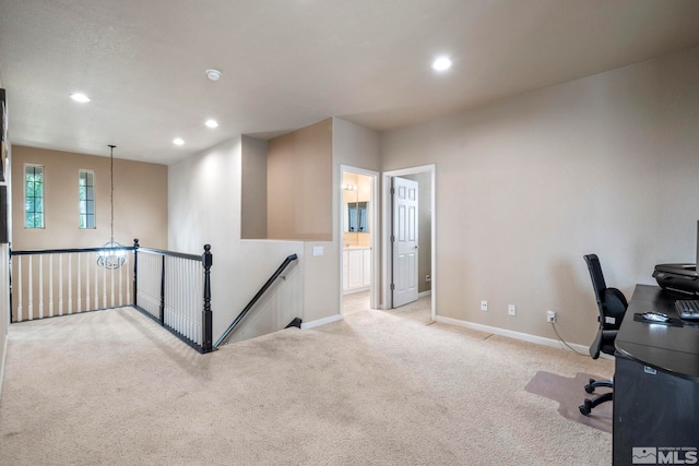 office with recessed lighting, baseboards, a notable chandelier, and light colored carpet