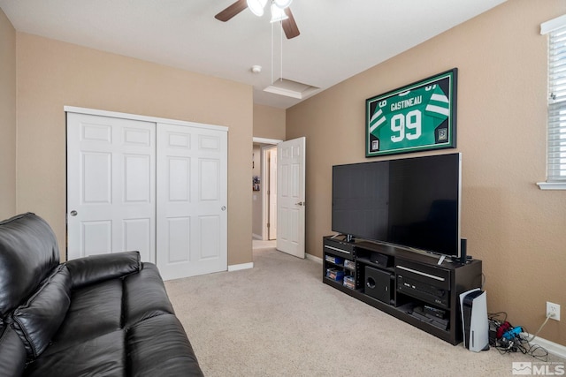 living room with ceiling fan and light carpet