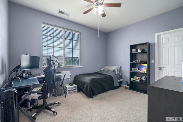 bedroom featuring ceiling fan, visible vents, and carpet flooring