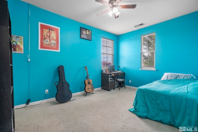 bedroom featuring carpet floors, visible vents, baseboards, and a ceiling fan