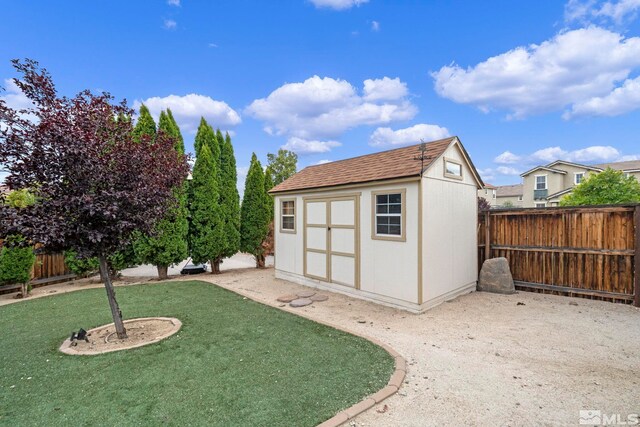 view of outbuilding with a lawn