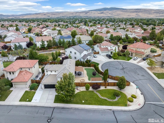 birds eye view of property with a mountain view