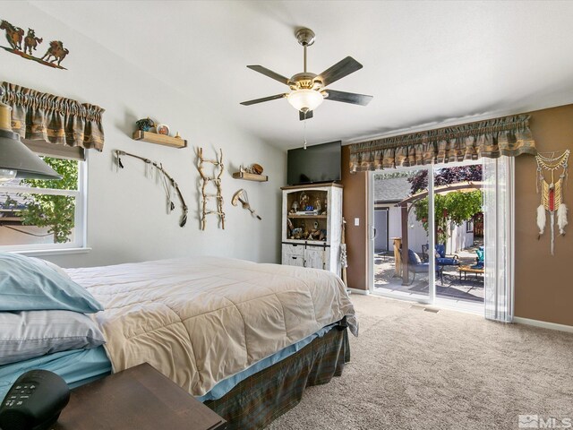 carpeted bedroom featuring ceiling fan and access to exterior