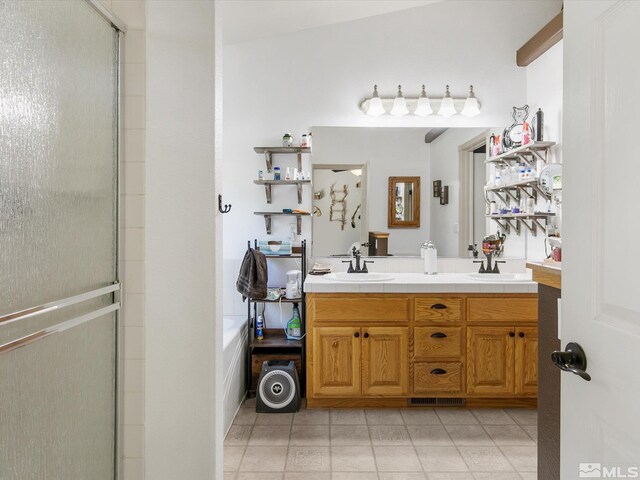 bathroom with tile patterned flooring, vaulted ceiling, shower with separate bathtub, and vanity