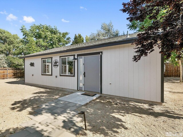 back of property with a patio area