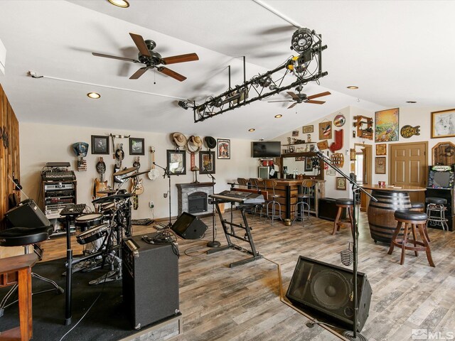 interior space with hardwood / wood-style floors and ceiling fan