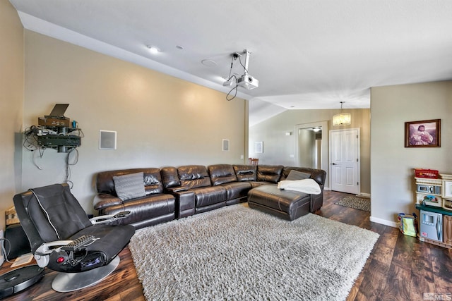 living room featuring dark hardwood / wood-style flooring and lofted ceiling