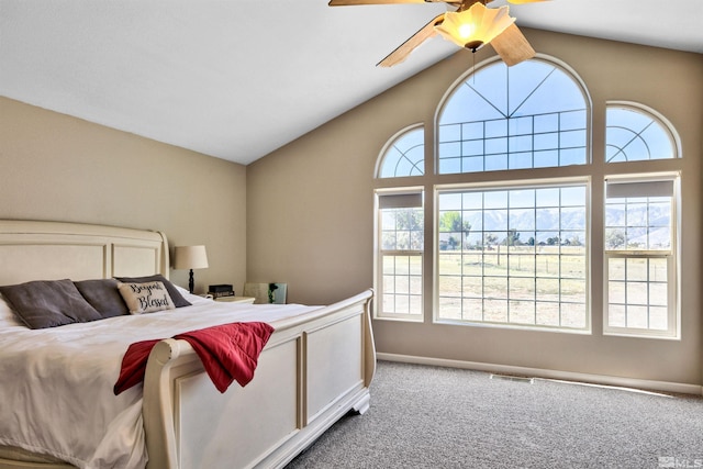 carpeted bedroom with ceiling fan and lofted ceiling