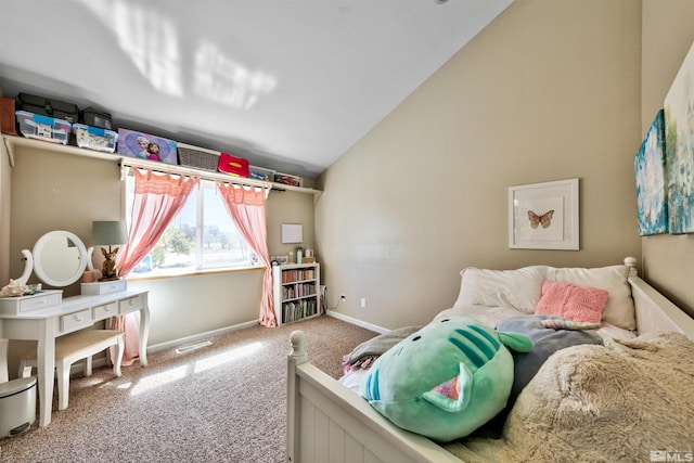 carpeted bedroom featuring lofted ceiling