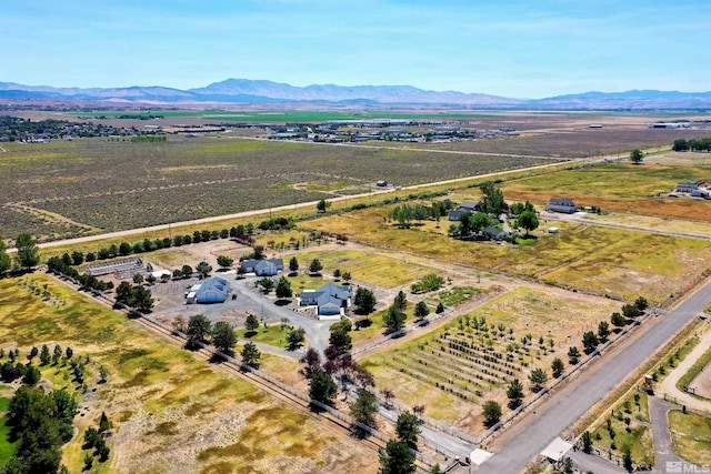 drone / aerial view with a mountain view and a rural view