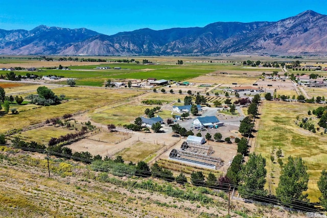 drone / aerial view featuring a mountain view and a rural view