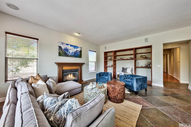 living room with dark tile patterned flooring