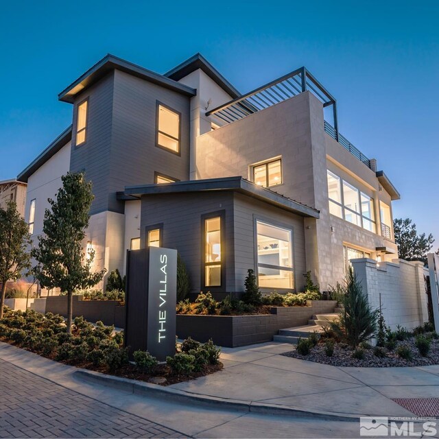 view of front of property with a balcony