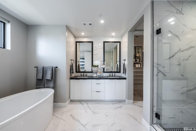 bathroom with independent shower and bath, vanity, and tile patterned floors