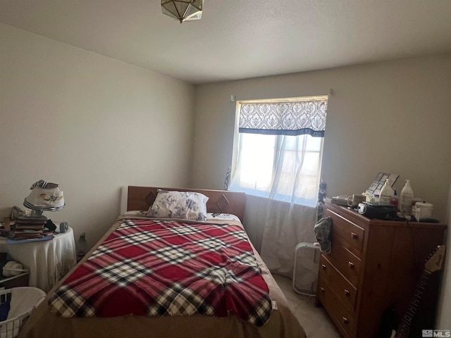 bedroom featuring carpet