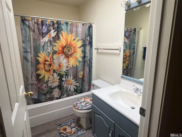 full bathroom with vanity, toilet, wood-type flooring, and shower / bath combo with shower curtain