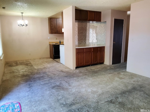 kitchen featuring light carpet, a textured ceiling, and a notable chandelier