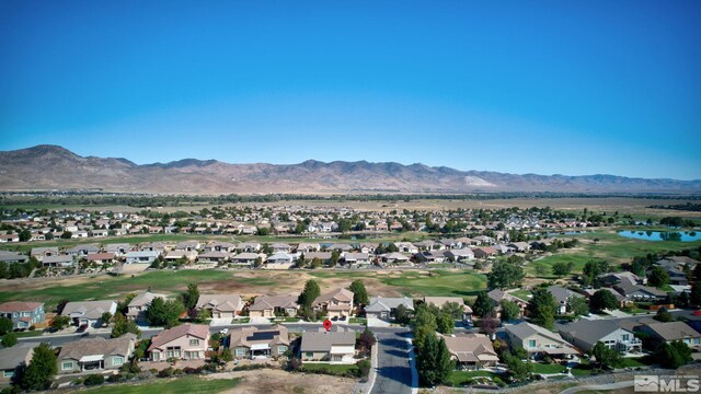 birds eye view of property featuring a mountain view