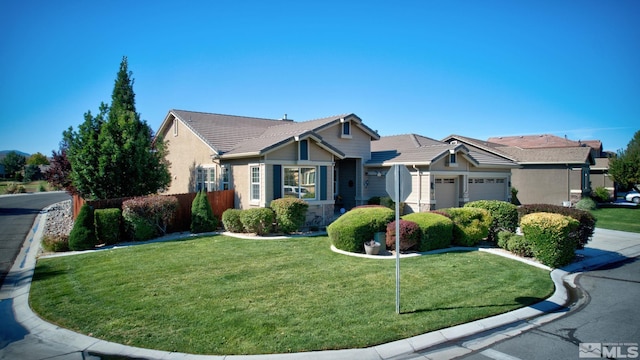 view of front of property featuring a tiled roof, stucco siding, an attached garage, and a front yard