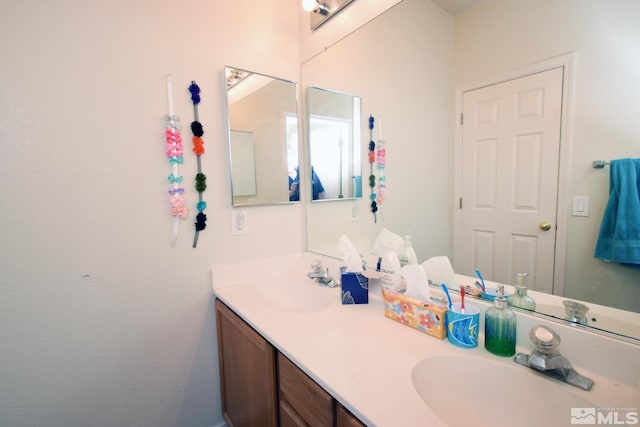 bathroom featuring double vanity and a sink