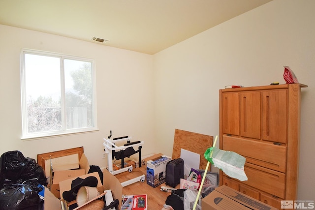 miscellaneous room featuring light wood-style flooring and visible vents