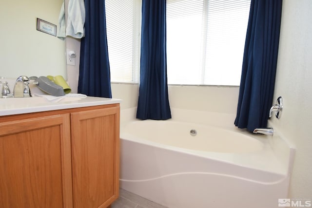 full bathroom with a bath and vanity