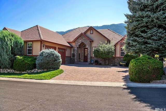 view of front of house with a mountain view and a garage