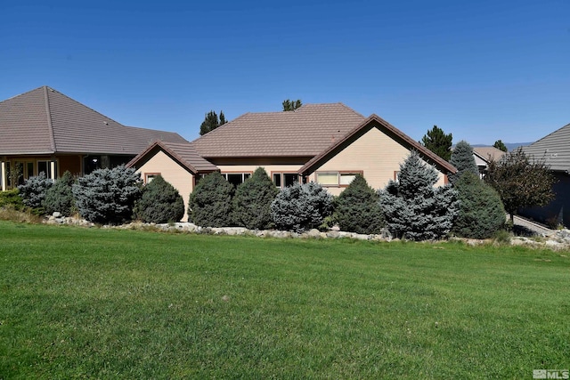 view of home's exterior featuring a lawn