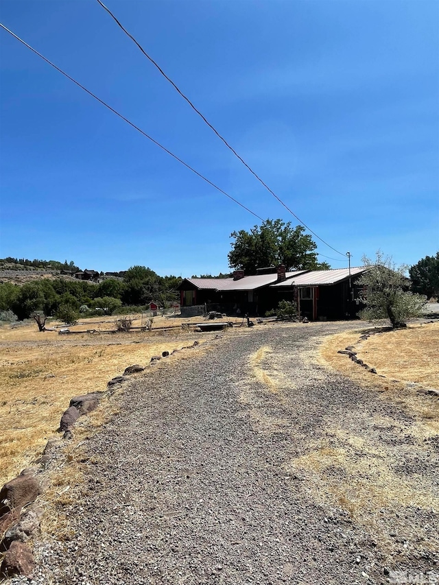 view of yard with a rural view