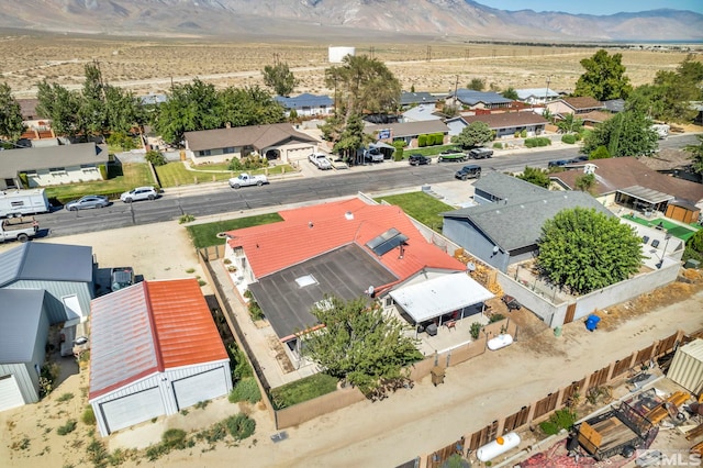 birds eye view of property with a residential view, view of desert, and a mountain view