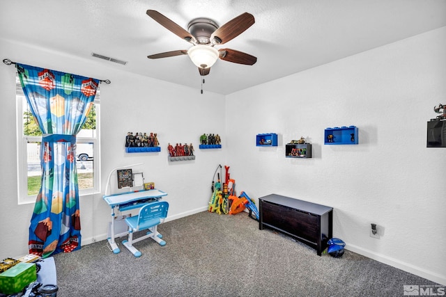 game room featuring carpet floors, visible vents, a ceiling fan, a textured ceiling, and baseboards