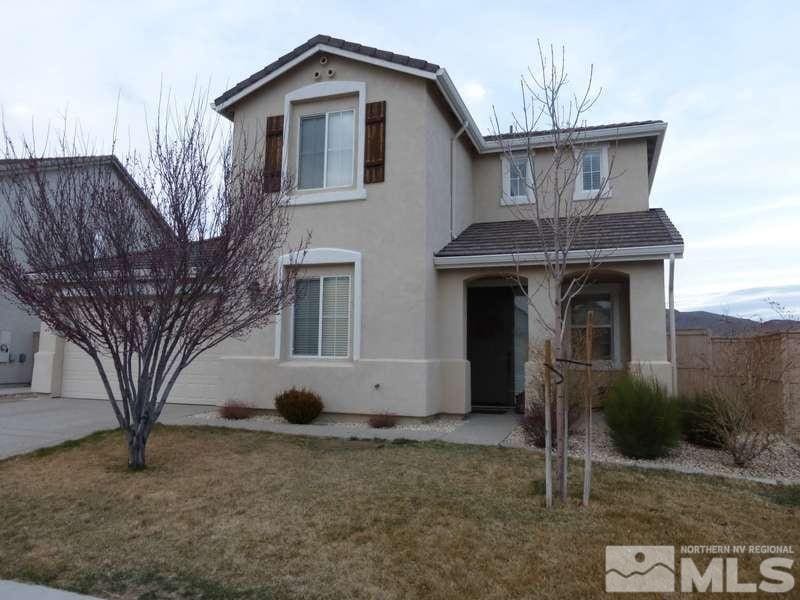 view of front property with a garage and a front lawn