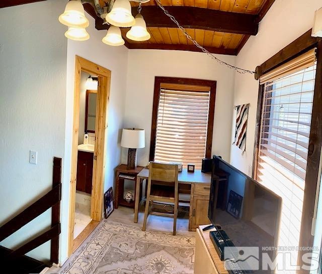 home office featuring a wealth of natural light, beam ceiling, and wooden ceiling