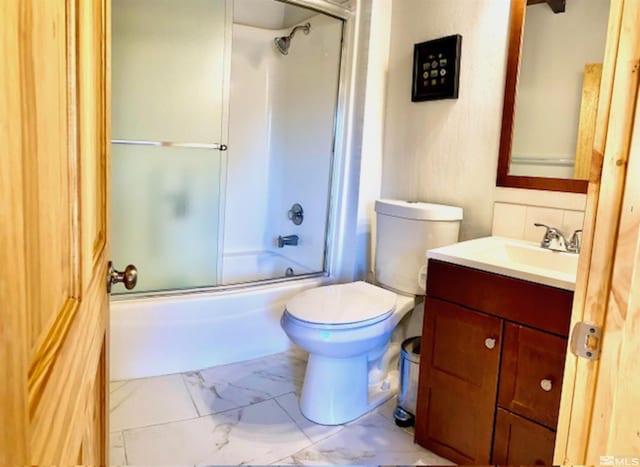 full bath featuring marble finish floor, tasteful backsplash, toilet, enclosed tub / shower combo, and vanity