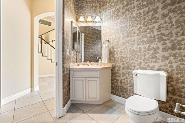 bathroom with vanity, toilet, and tile patterned floors