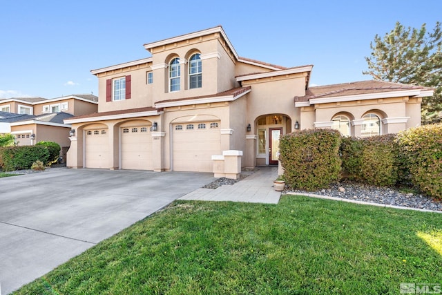 view of front of house with a garage and a front yard