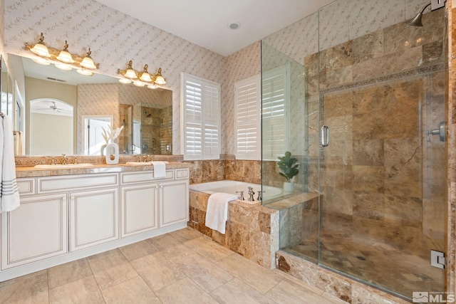 bathroom with tile patterned flooring, separate shower and tub, ceiling fan, and vanity