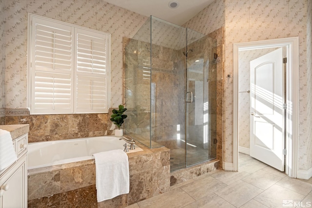 bathroom featuring tile patterned flooring, vanity, and separate shower and tub