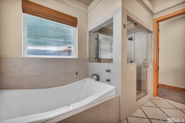 bathroom featuring tile patterned flooring and plus walk in shower