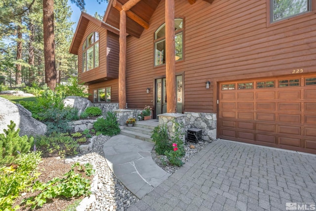 view of side of home featuring a garage