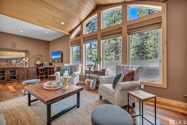 living room with wood ceiling, high vaulted ceiling, and wood-type flooring