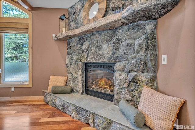 interior details with hardwood / wood-style flooring and a fireplace