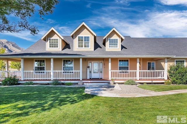 view of front of home featuring a front yard and a porch