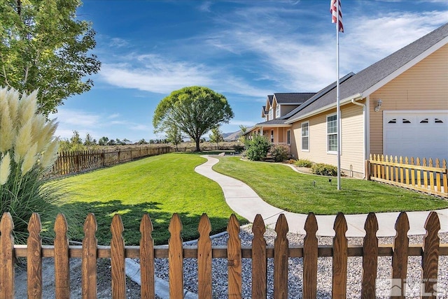 view of yard featuring a garage