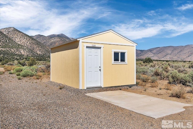 view of outbuilding with a mountain view