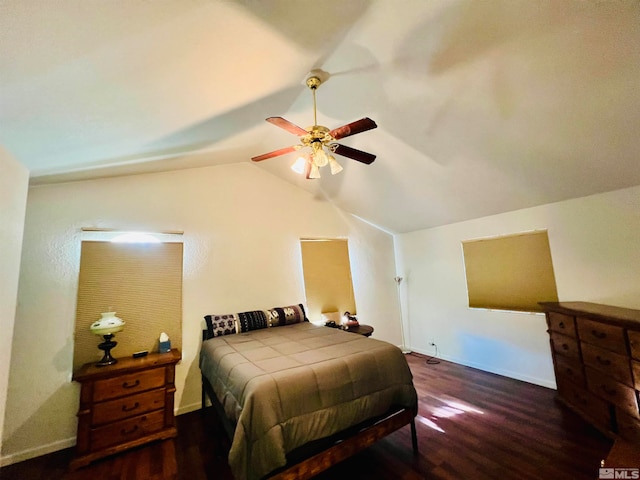 bedroom featuring lofted ceiling, ceiling fan, and dark hardwood / wood-style floors