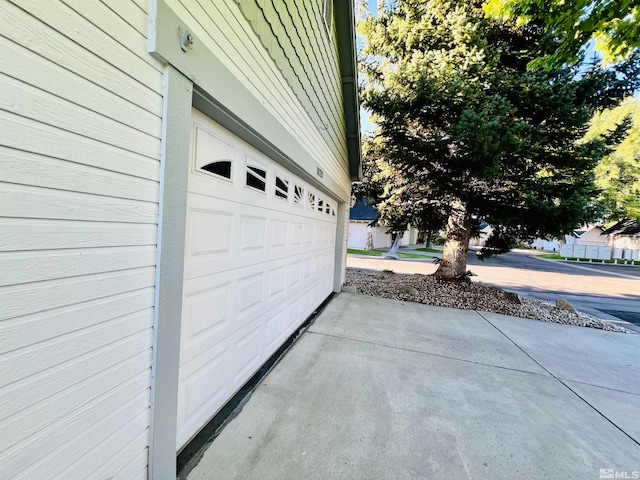 view of property exterior with a garage