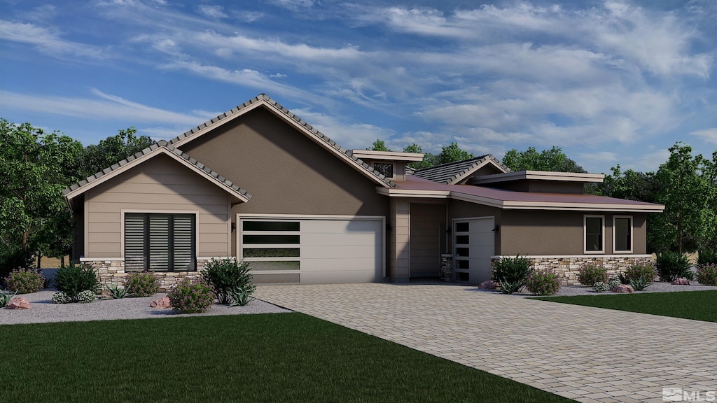 view of front facade with a garage and a front yard