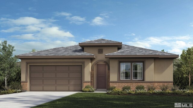 prairie-style house featuring a front lawn and a garage