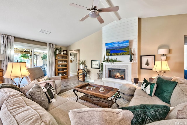 living room featuring a fireplace, lofted ceiling with beams, hardwood / wood-style flooring, and ceiling fan